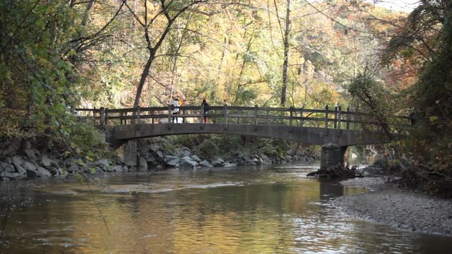 Tourists on Bluff Bridge - Wide Shot  - Rock Creek Park - Washington, DC - Autumn