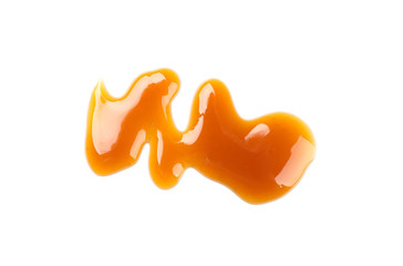 Sweet caramel sauce isolated on white background, close up