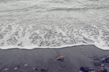 wet stone on sand