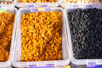 Dried fruits on counter for sale.