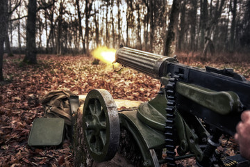 Fototapeta na wymiar retro machine gun in the forest