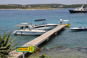 Naklejka premium Ceja Island (Otok Ceja) wharf with name sign