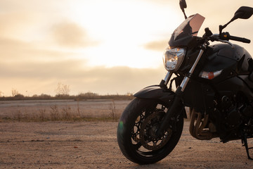 Fototapeta na wymiar One black motorcycle in the desert.