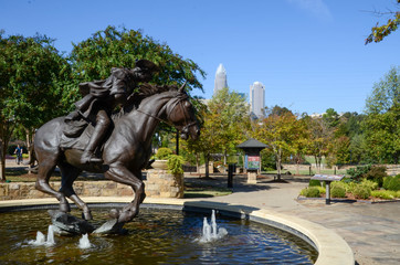 Captain James Jack statue in Elizabeth Park. Charlotte NC. Sitting in a fountain is the bronze statue. Famous in the revolutionary times.