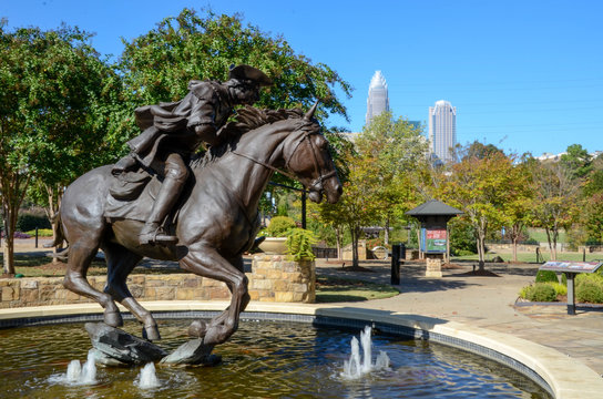 Captain James Jack statue in Elizabeth Park. Charlotte NC. Sitting in a fountain is the bronze statue. Famous in the revolutionary times.