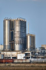 Oil refinery buildings with big silos