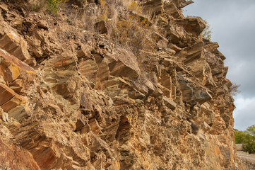 Texture and pattern of a large stone wall in a mountain