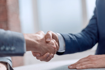 Obraz na płótnie Canvas close up. successful financial partners shaking hands.