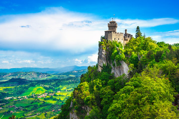 Fototapeta San Marino, medieval tower on a rocky cliff and panoramic view of Romagna obraz