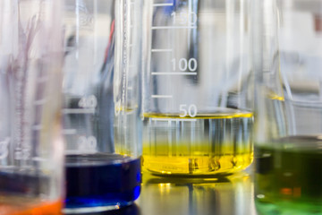 Beakers containing colored liquids