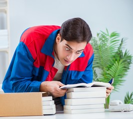 Worker in publishing house preparing book order