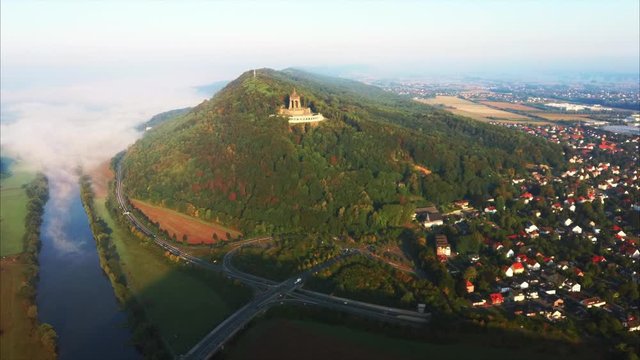 Aerial footage of Kaiser Wilhelm monument Porta Westfalica with river Weser in the background