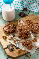 Baked christmas cookies. Homemade Chocolate chip cookies and milk on a wooden rustic table.