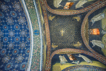 RAVENNA, ITALY - September 11, 2019: Travel view of Ravenna featuring Mausoleum Galla Placidia mosaic stars sky cross ceiling. The image location is Emilia Romagna in Italy, Europe.