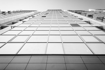 Black and white building. Glass and metal