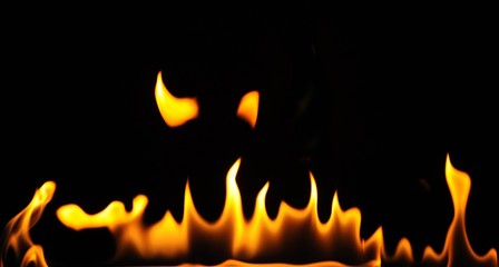 Close-up flames of an alcohol burner on a dark background