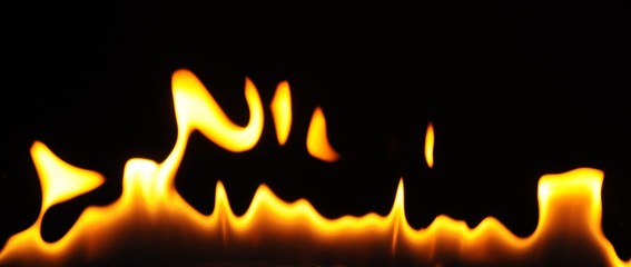 Close-up flames of an alcohol burner on a dark background