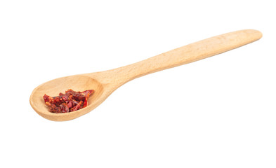 Dry red pepper in spoon