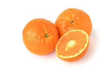 Two tangerines and half isolated on white
