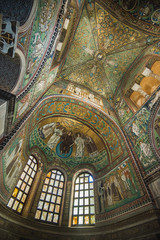 Fototapeta na wymiar Ravenna, Italy - September 11, 2019: Interior of Basilica of San Vitale, which has important examples of early Christian Byzantine art and architecture. It was resignated as Unesco World Heritage. 