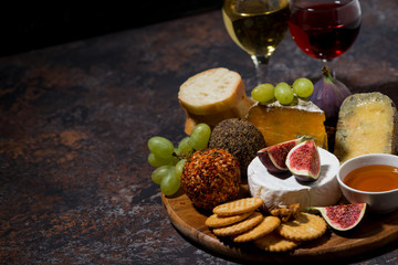 cheese, crackers and fruits, delicious wine snacks, top view