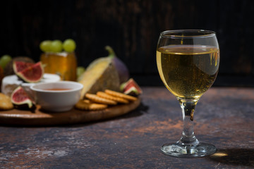 glass of white wine and snacks