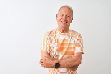 Senior grey-haired man wearing striped t-shirt standing over isolated white background happy face...