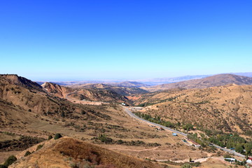 Fototapeta na wymiar Scenic landscape of Tian Shan mountain range near Chimgan in Uzbekistan