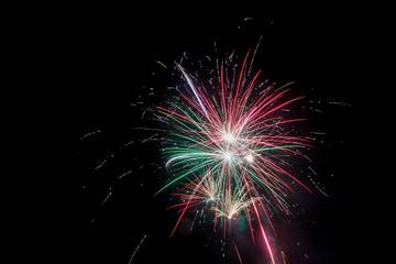 Fototapeta premium Beautiful fireworks at night. Festive fireworks display lit up over night sky. Celebration concept.