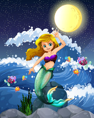 Mermaid and fish in the sea