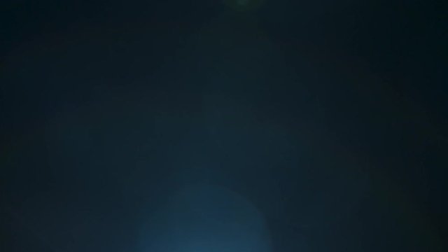 Blue light efect with lens flare over black background