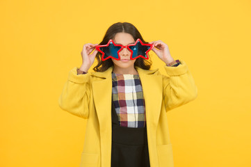 Popular schoolgirl. Carnival costume famous celebrity. Rock star. Cool kid star shaped sunglasses. Star concept. Fame and popularity. Party holiday celebration. Cheerful girl wear eyeglasses for fun