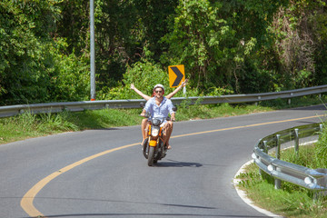 Happy couple on a scooter