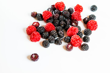 Black and red raspberry composition on a white background.
