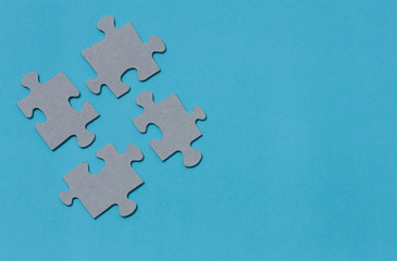 Puzzle pieces on blue background.