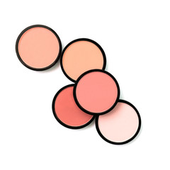 Coral blush and compact powder on white background. Isolated. Beautiful colorful beauty template. For advertisement. Trending shades. Makeup. Cosmetic products. Flat lay