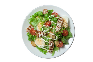 Caesar salad with grill chicken fillet isolated on white background