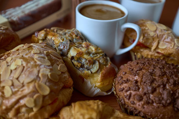 Coffee cup or hot chocolate with chocolate cookie, nuts on wooden table.Top view, Coffe break. macro