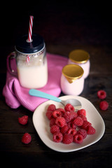 Yogurt breakfast with raspberries and milk