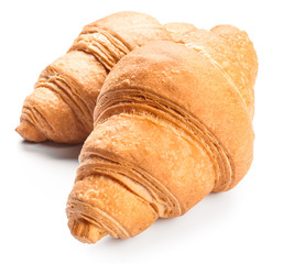 Sweet tasty croissants on white background