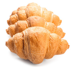 Sweet tasty croissants on white background