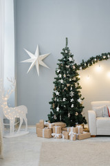 Traditional Christmas tree in the living room in pastel colors