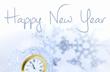 Image for New Year includes the face of a clock nearing twelve o'clock and sparkly accent pieces....
