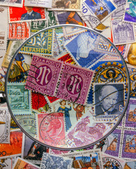 postage stamps with magnify glass