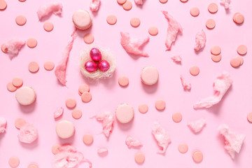 Tasty macarons and sweets on color background