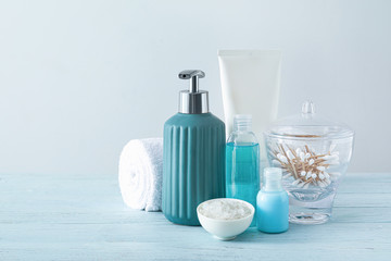 Cosmetics with towel on table