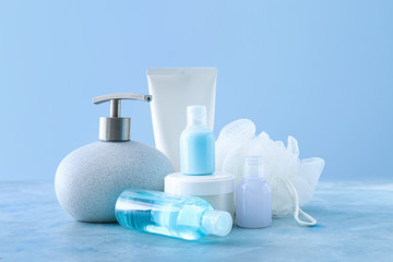 Cosmetics with bast wisp on color background