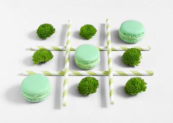 Creative composition with macarons on white background