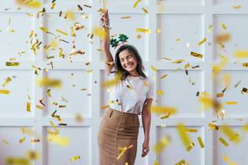 Portrait of young woman with glass celebrate Christmas or New Year