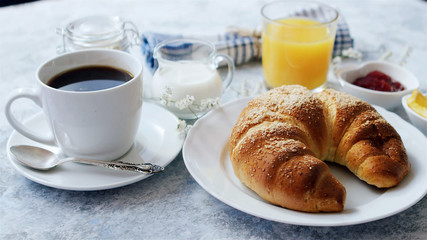 French breakfast with fresh coffee and croissant